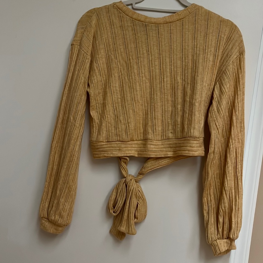 Open backed long sleeve crop top
